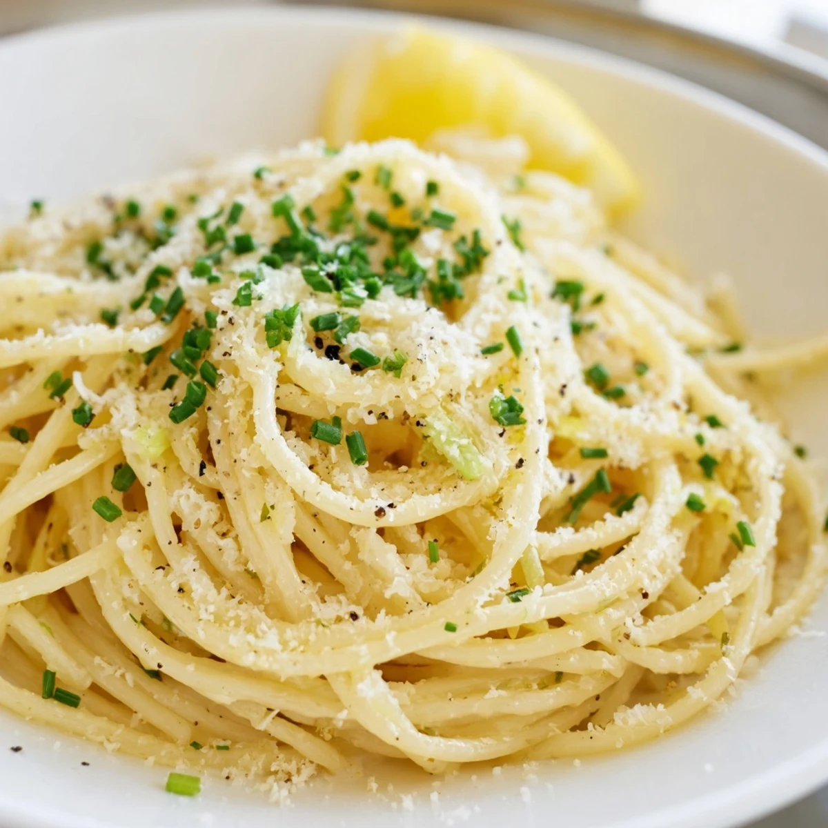 Golden, glistening Miso Butter Pasta tossed with Parmesan and fresh chives, a flavorful vegetarian main dish.