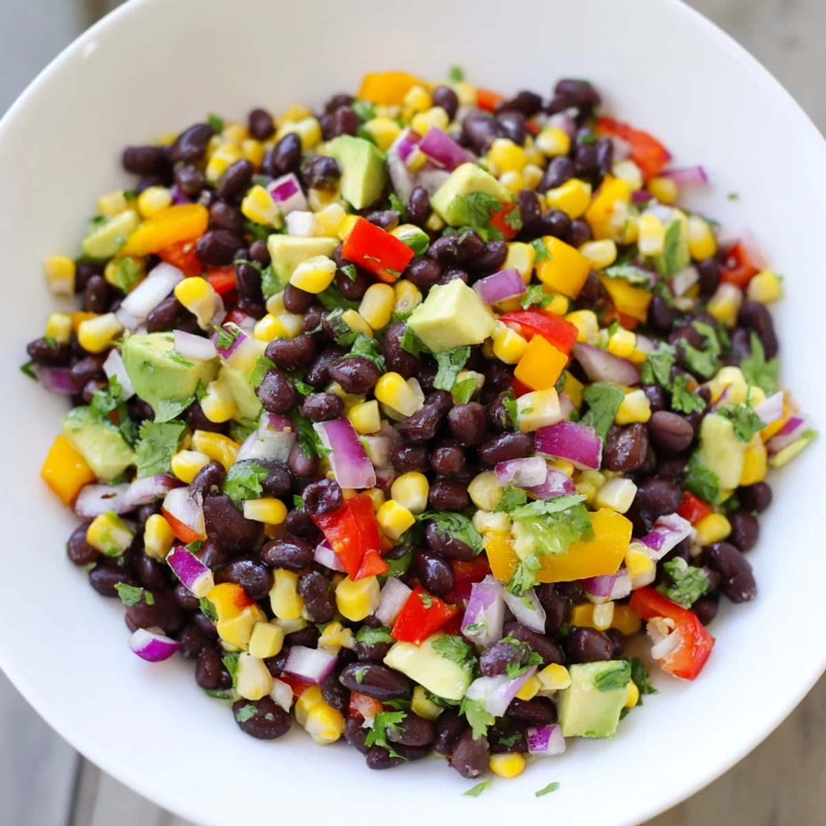 A colorful Southwest Black Bean Salad with fresh cilantro, ready to be enjoyed!