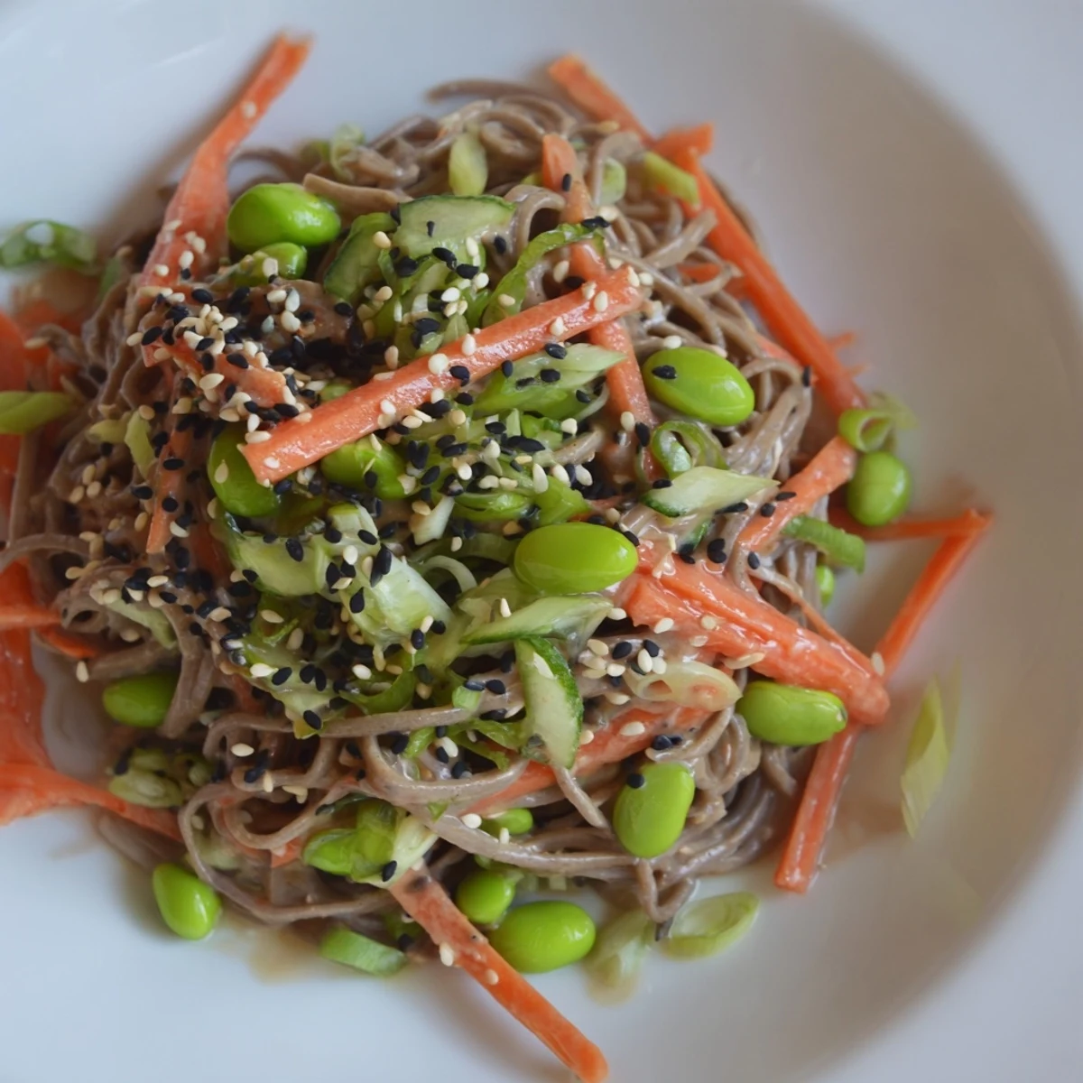Vibrant Asian Sesame Noodle Salad, a flavorful cold dish with colorful veggies, ready to enjoy.