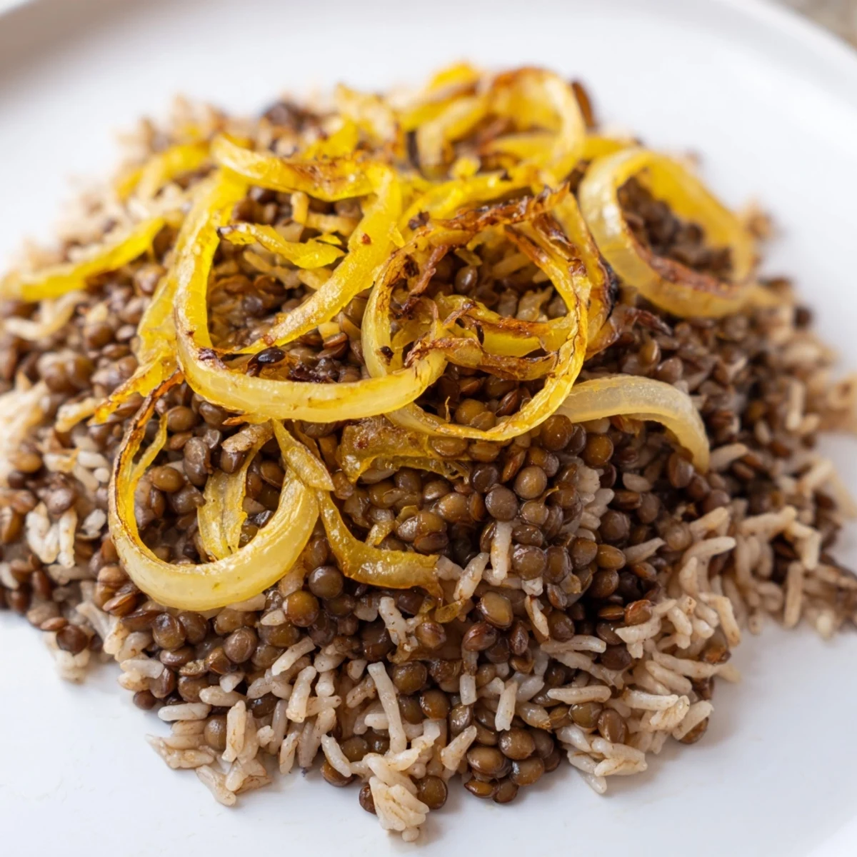 Fragrant Lebanese Mjadra: a vibrant bowl of fluffy rice, tender lentils, and beautifully caramelized onions.
