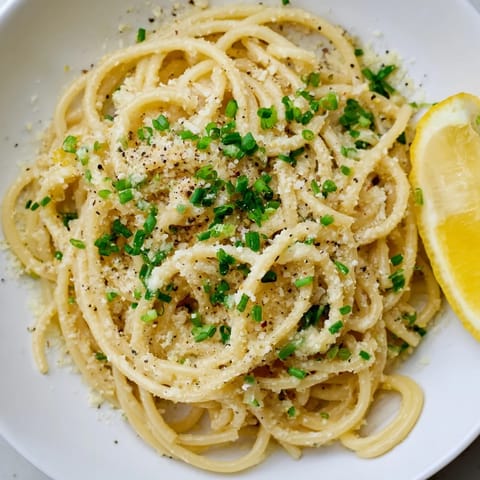Silky spaghetti coated in savory miso butter sauce, a closeup view of the delicious Miso Butter Pasta.