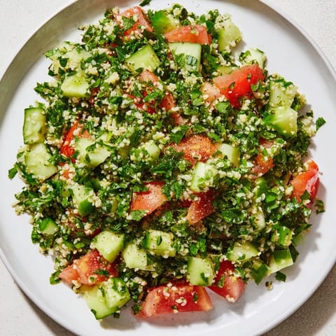 Close-up of a bowl of refreshing Lebanese Tabbouleh, showcasing the finely chopped parsley and bulgur wheat.