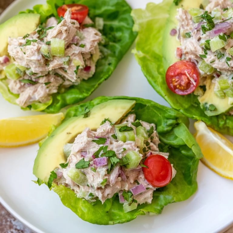 Spoonful of creamy tuna salad nestled in butter lettuce, perfect for low-carb Tuna Salad Lettuce Wraps.
