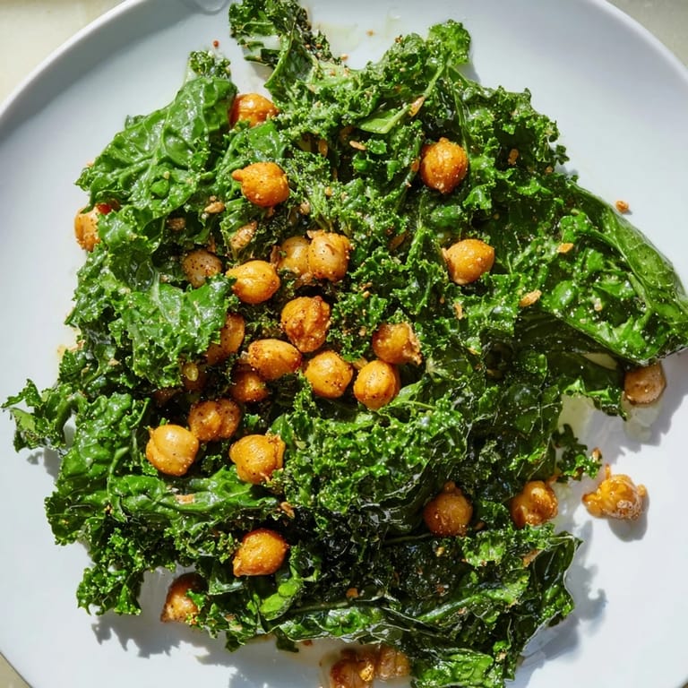 Imagine a vibrant bowl of Warm Kale Salad with Crispy Chickpeas and a bright, zesty lemon dressing.