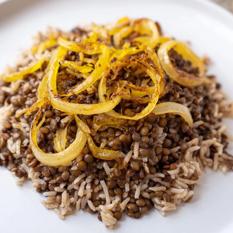 Fragrant Lebanese Mjadra: a vibrant bowl of fluffy rice, tender lentils, and beautifully caramelized onions.