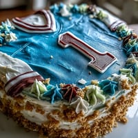 Festive graduation cake shaped like a sports jersey with vibrant team colors and personalized details for a celebratory dessert.